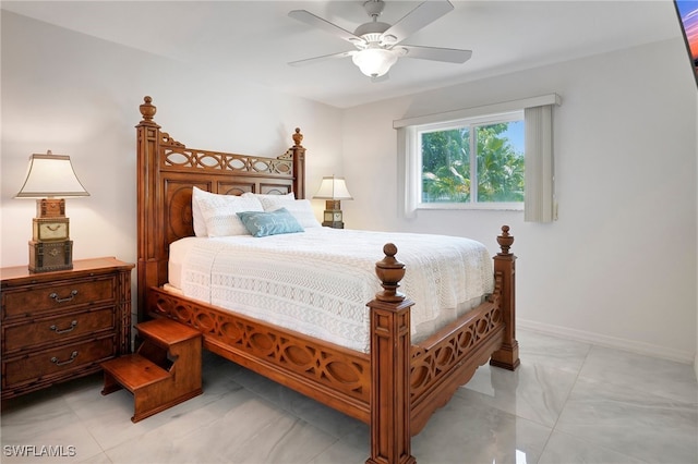 tiled bedroom featuring ceiling fan