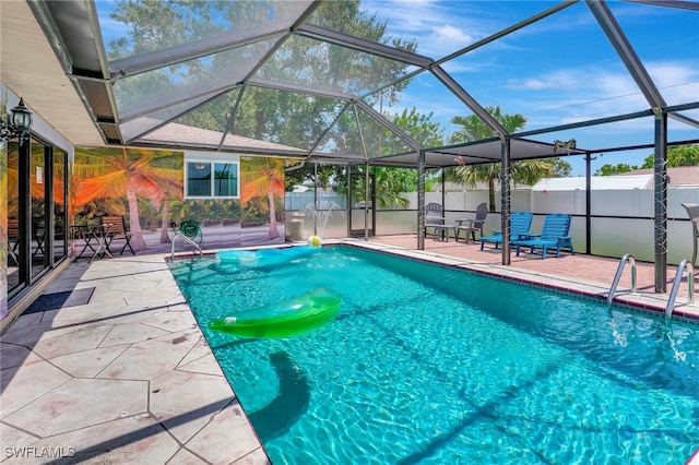 view of pool featuring a patio and a lanai