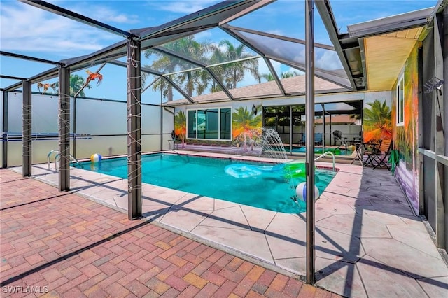 view of swimming pool featuring pool water feature, a lanai, and a patio area