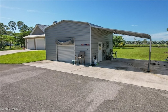 garage with a yard