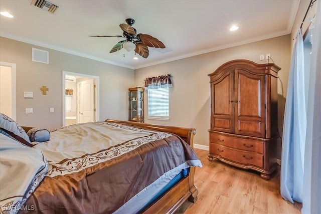 bedroom featuring light wood-style floors, visible vents, and ornamental molding