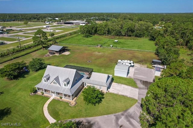 birds eye view of property featuring a wooded view