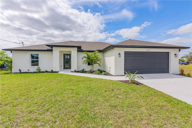 view of front of home with concrete driveway, stucco siding, an attached garage, and a front yard