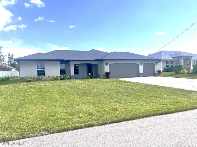 view of front facade featuring a garage and a front lawn