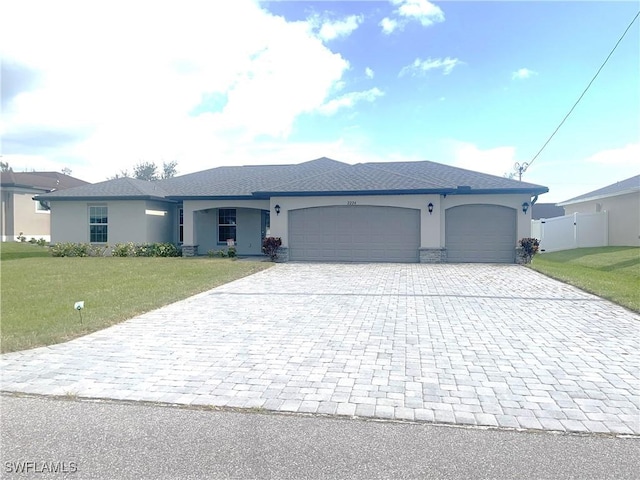 ranch-style home featuring decorative driveway, stucco siding, fence, a garage, and a front lawn