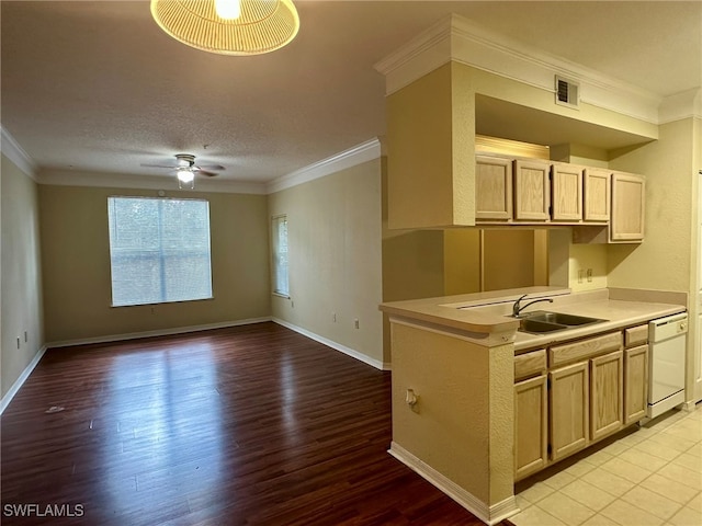 kitchen featuring white dishwasher, ornamental molding, light brown cabinets, and light wood-type flooring