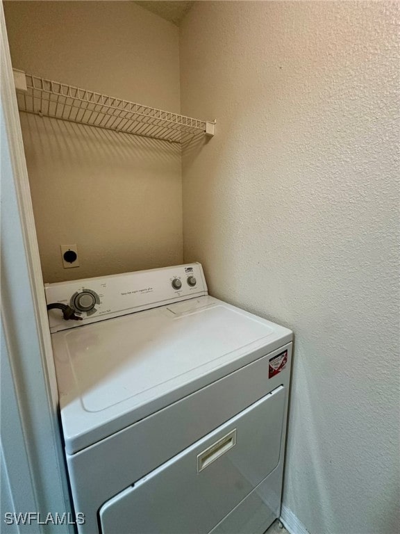 washroom featuring washer / dryer