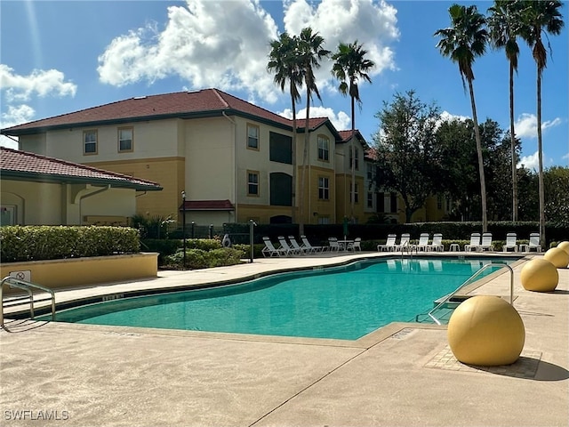 view of swimming pool with a patio area