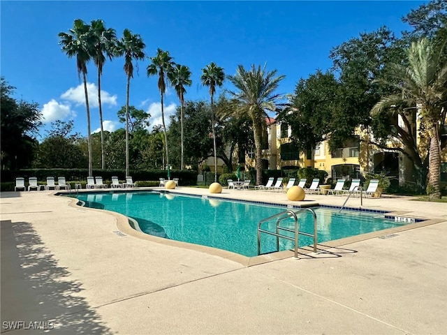 view of swimming pool with a patio area