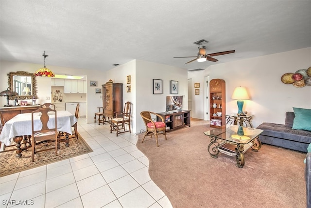 tiled living room featuring ceiling fan and a textured ceiling