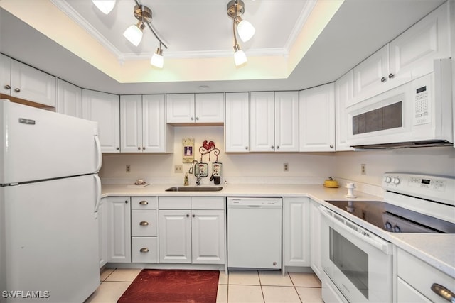 kitchen featuring a tray ceiling, white appliances, ornamental molding, and track lighting