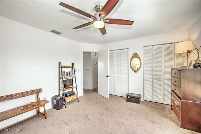 misc room featuring ceiling fan and light colored carpet