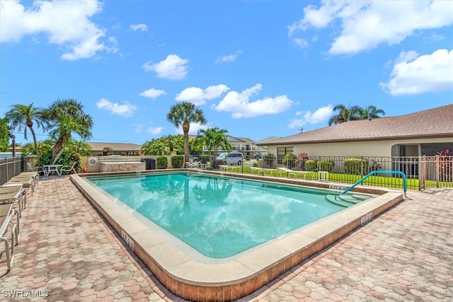 view of pool featuring a patio