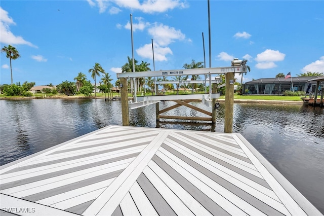 dock area featuring a water view and a lanai