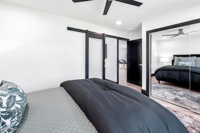 bedroom featuring wood finished floors and a ceiling fan