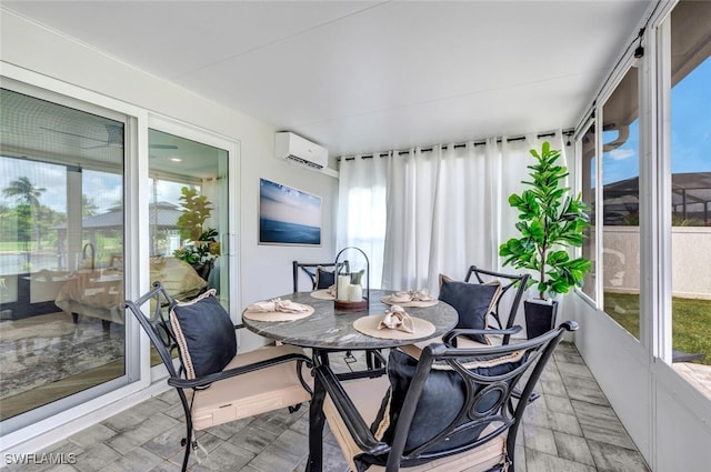 sunroom / solarium with a wall unit AC