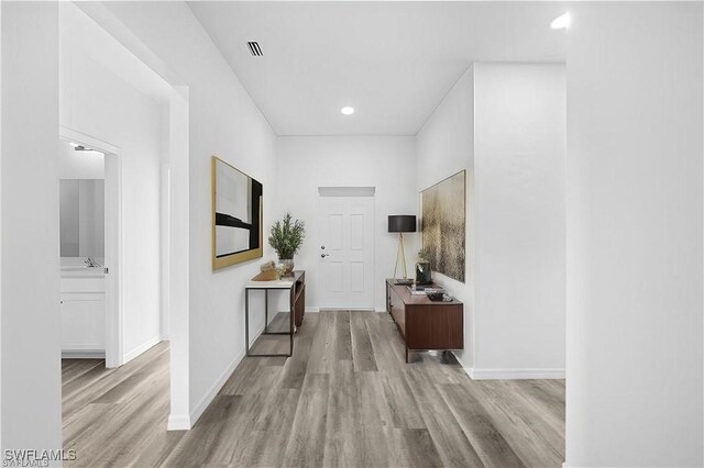 corridor featuring light hardwood / wood-style flooring