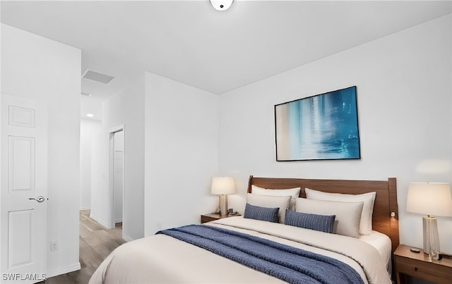 bedroom featuring hardwood / wood-style flooring