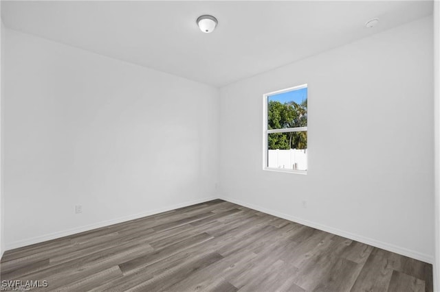 empty room featuring wood-type flooring