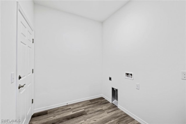 washroom with hookup for an electric dryer, hookup for a washing machine, and hardwood / wood-style floors