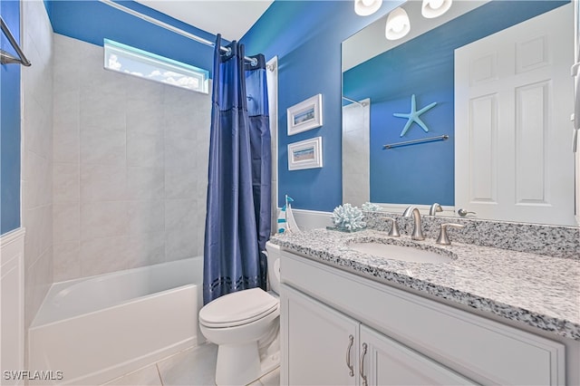 full bathroom with tile patterned floors, toilet, vanity, and shower / tub combo