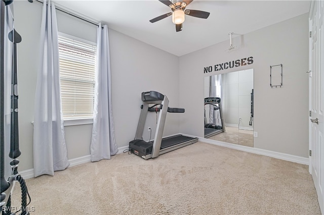 workout area featuring light colored carpet and ceiling fan