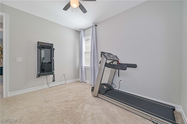 workout area with ceiling fan and light colored carpet