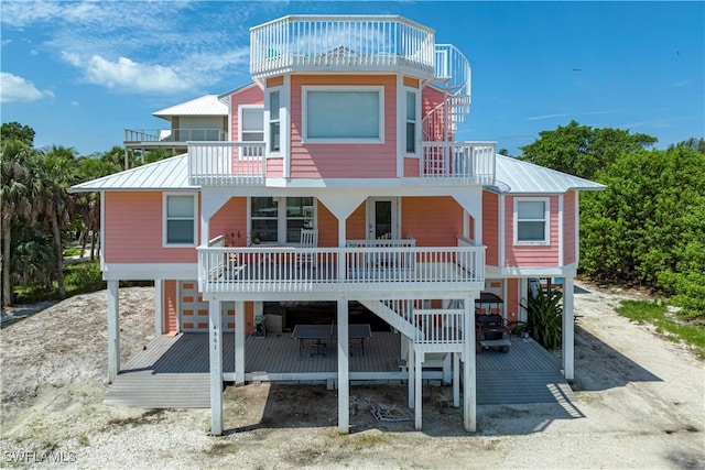 rear view of house with a balcony