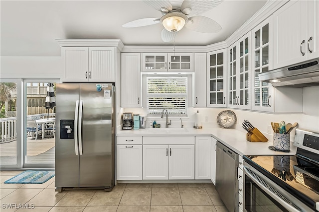 kitchen featuring appliances with stainless steel finishes, white cabinetry, and ceiling fan