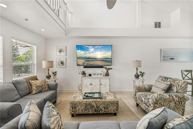 4501 Seair Ln, Upper Captiva, FL 33924 - living room with light tile patterned flooring, a high ceiling, baseboards, and recessed lighting