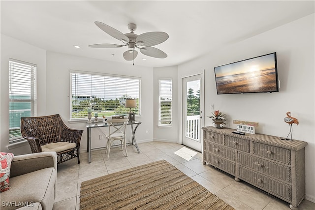 interior space with ceiling fan