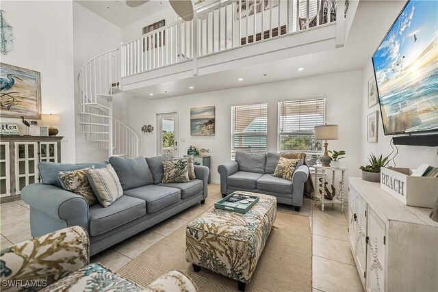 4501 Seair Ln, Upper Captiva, FL 33924 - living area featuring a towering ceiling, stairs, light tile patterned flooring, and plenty of natural light