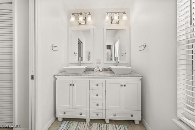 4501 Seair Ln, Upper Captiva, FL 33924 - full bathroom featuring double vanity, baseboards, and a closet