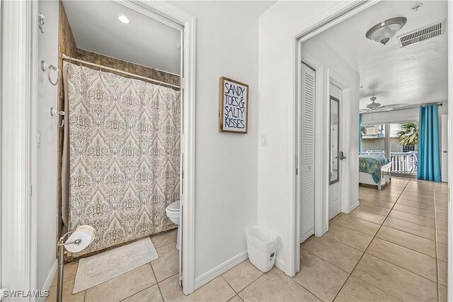 4501 Seair Ln, Upper Captiva, FL 33924 - bathroom with tile patterned flooring, toilet, a closet, a ceiling fan, and baseboards