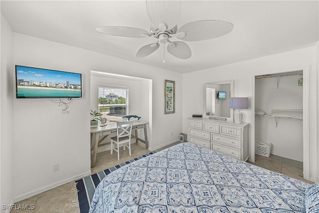 4501 Seair Ln, Upper Captiva, FL 33924 - tiled bedroom with a ceiling fan, baseboards, a desk, and a closet