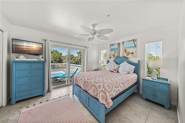 bedroom featuring ceiling fan, access to exterior, and light tile patterned flooring