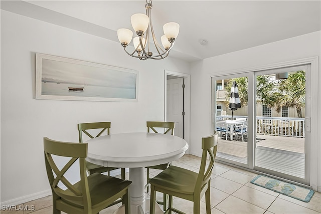 dining room featuring light tile patterned floors and a notable chandelier