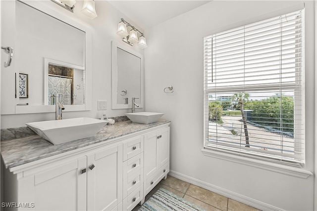 bathroom featuring tile patterned flooring and vanity