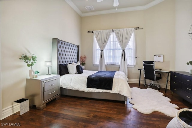 bedroom with ornamental molding and dark hardwood / wood-style floors