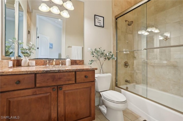 full bathroom featuring vanity, combined bath / shower with glass door, tile patterned floors, and toilet