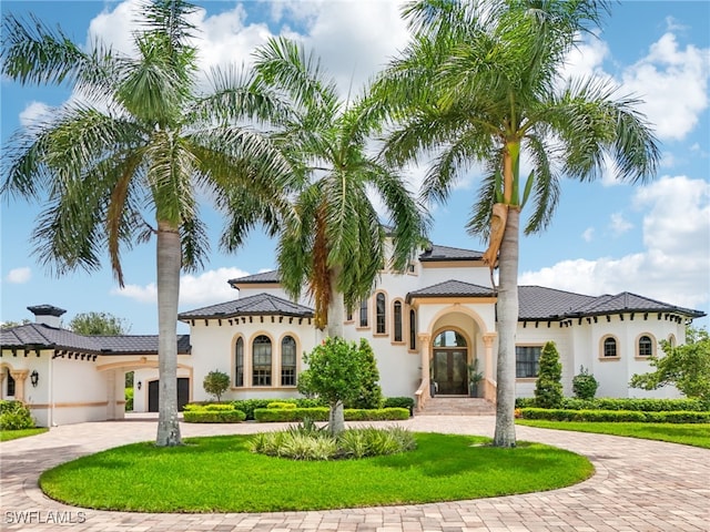 mediterranean / spanish house featuring french doors