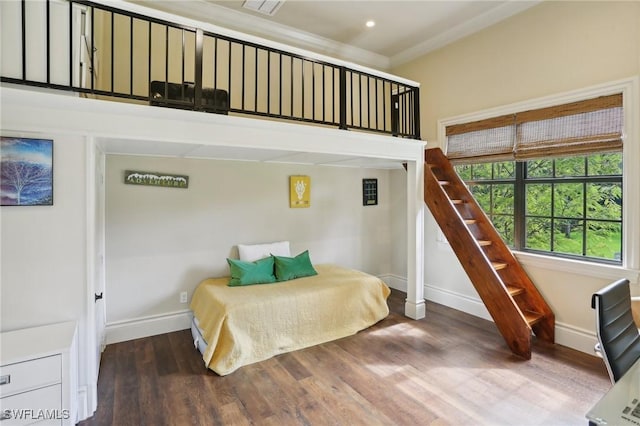 bedroom featuring hardwood / wood-style flooring and ornamental molding