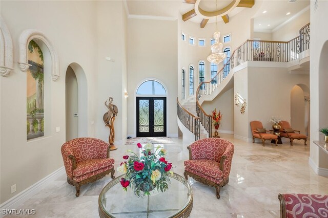 living area featuring baseboards, stairs, ornamental molding, arched walkways, and marble finish floor