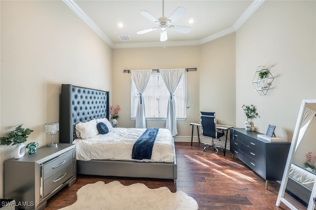 bedroom with visible vents, baseboards, dark wood finished floors, ornamental molding, and a ceiling fan