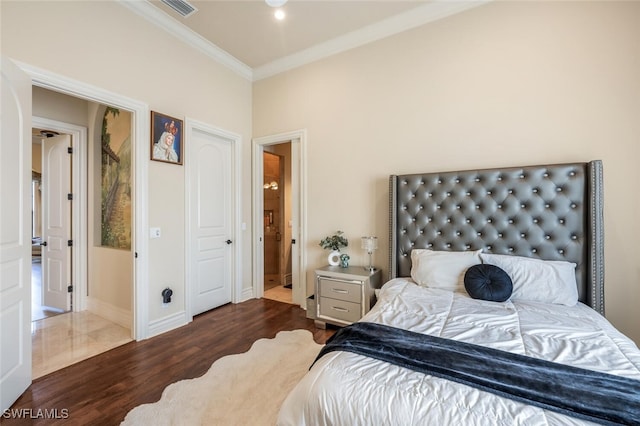 bedroom featuring visible vents, ornamental molding, baseboards, and dark wood-style flooring