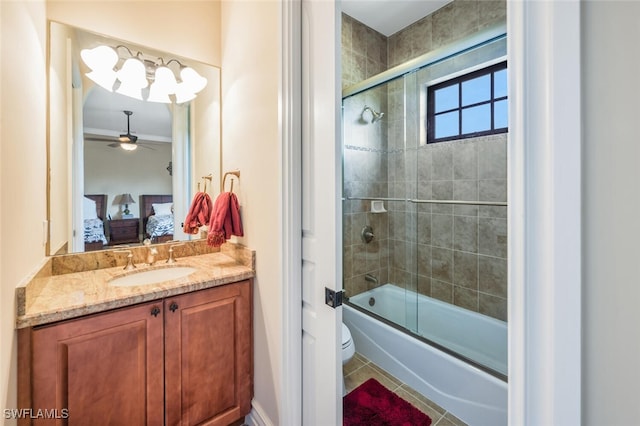 ensuite bathroom featuring tile patterned flooring, ceiling fan, toilet, ensuite bathroom, and enclosed tub / shower combo