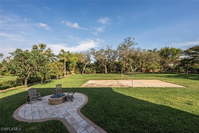 view of yard featuring a patio and an outdoor fire pit