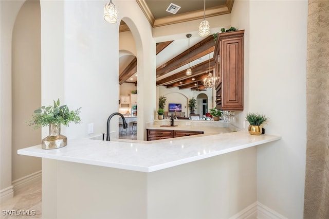 bar featuring beamed ceiling, pendant lighting, visible vents, and ornamental molding