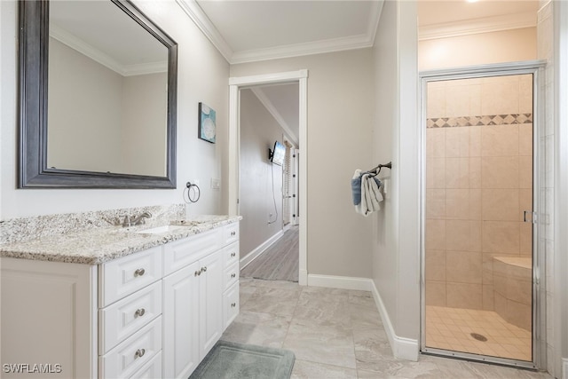 bathroom with crown molding, tile patterned flooring, and vanity