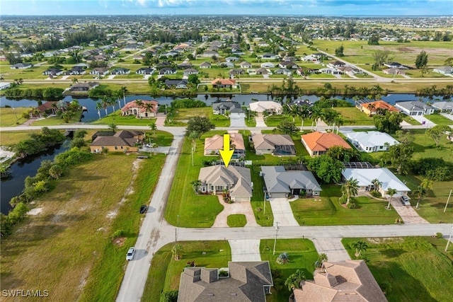 bird's eye view with a water view